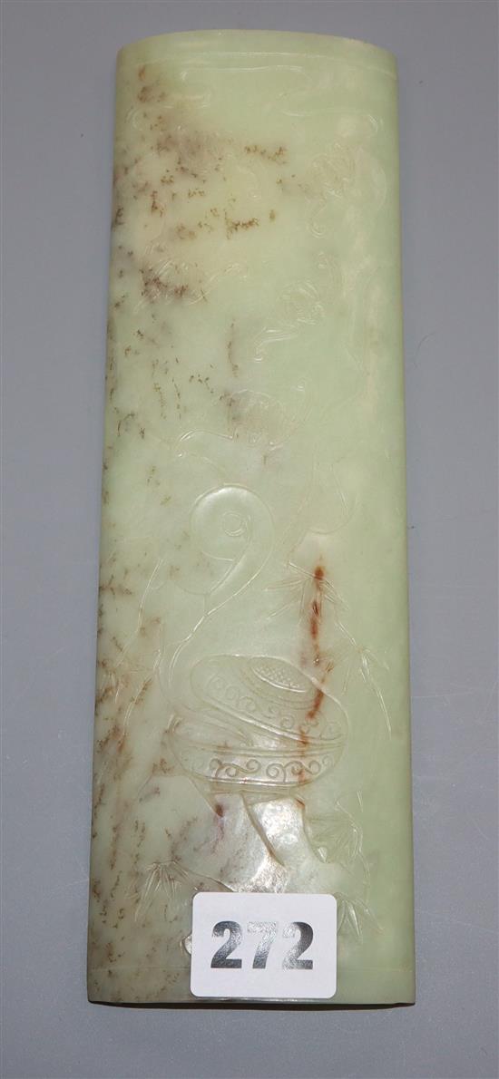 A Chinese Celadon jade wrist rest
